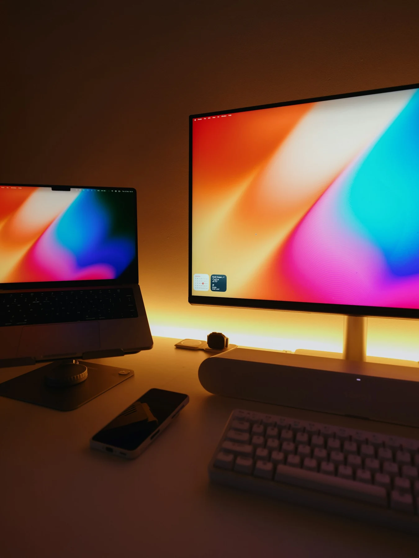 Laptop and desktop monitor on a complete workspace